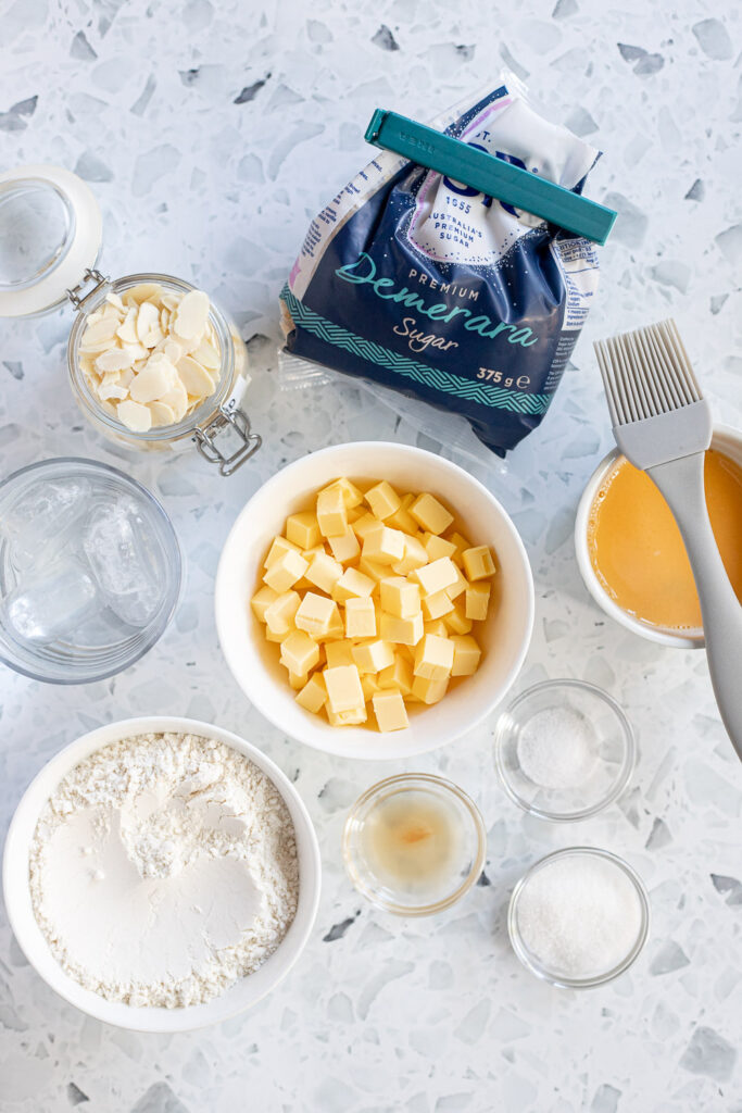 Overhead shot of pie crust ingredients, such as flour, butter, and salt,