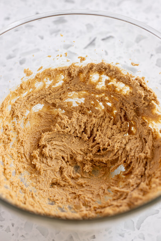 Butter and sugar creamed together showing light and fluffy texture