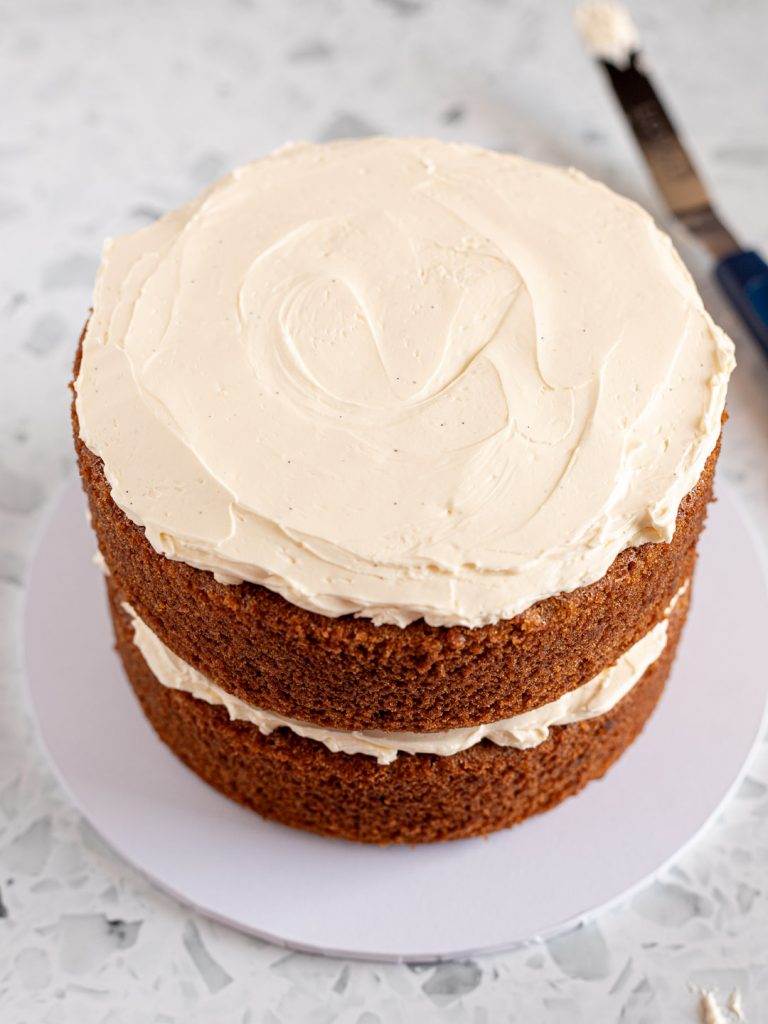 Second layer of vanilla chai sponge stacked with Swiss meringue buttercream.