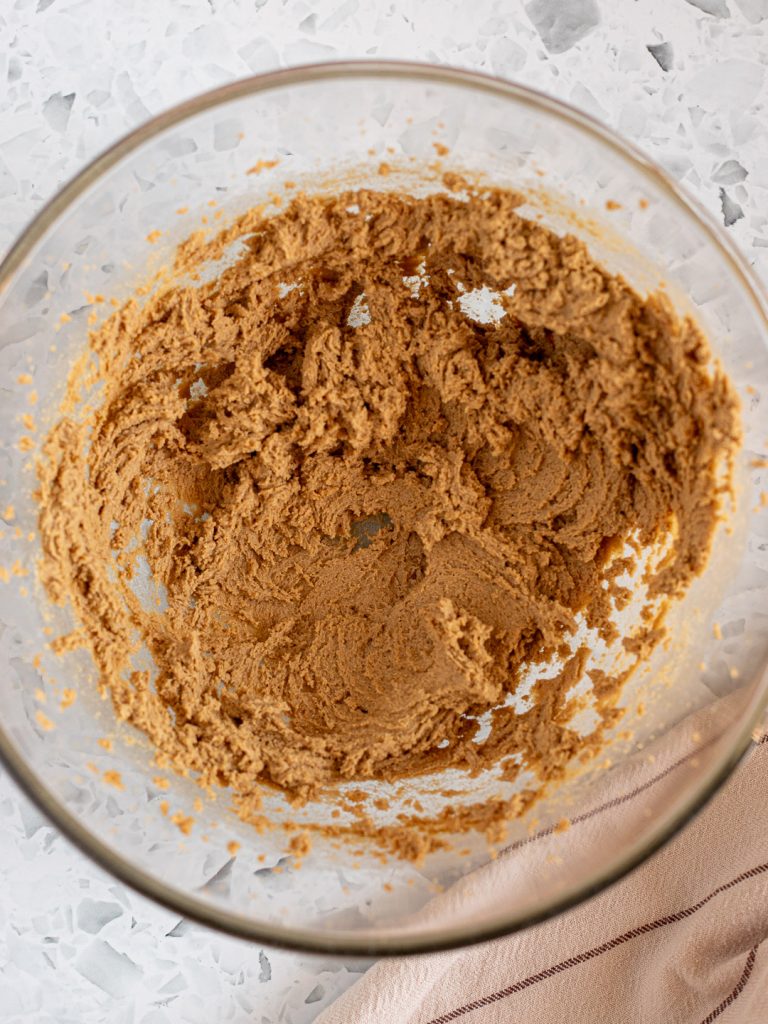 Butter and brown sugar creamed together in a large glass mixing bowl until light and fluffy.
